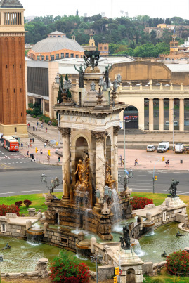 gallery/plaza-de-espana-monument-with-fountain-barcelona-spain-cloudy-sky-traffic